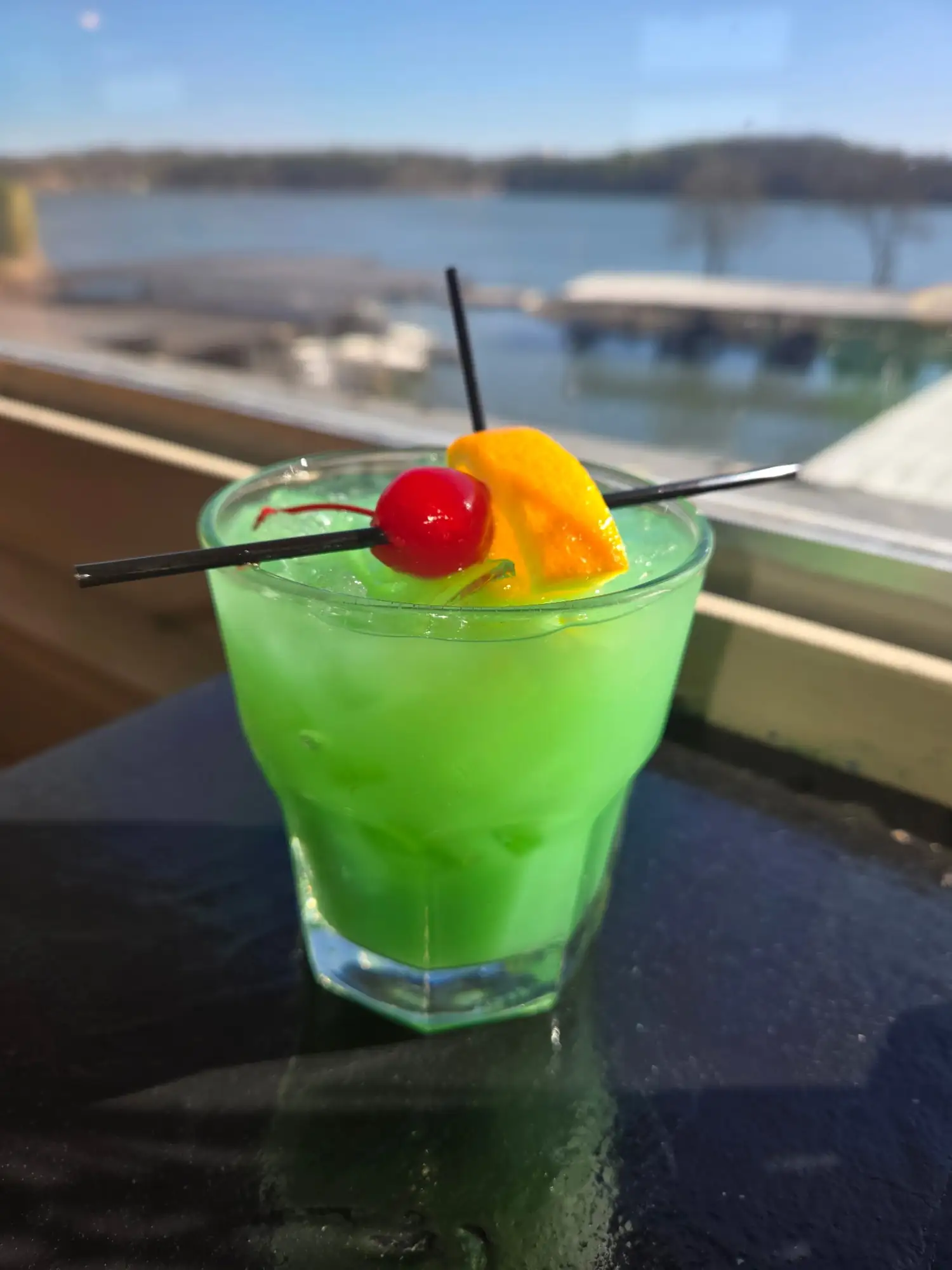 Drunken Leprechaun cocktail with blue Curaçao and orange juice